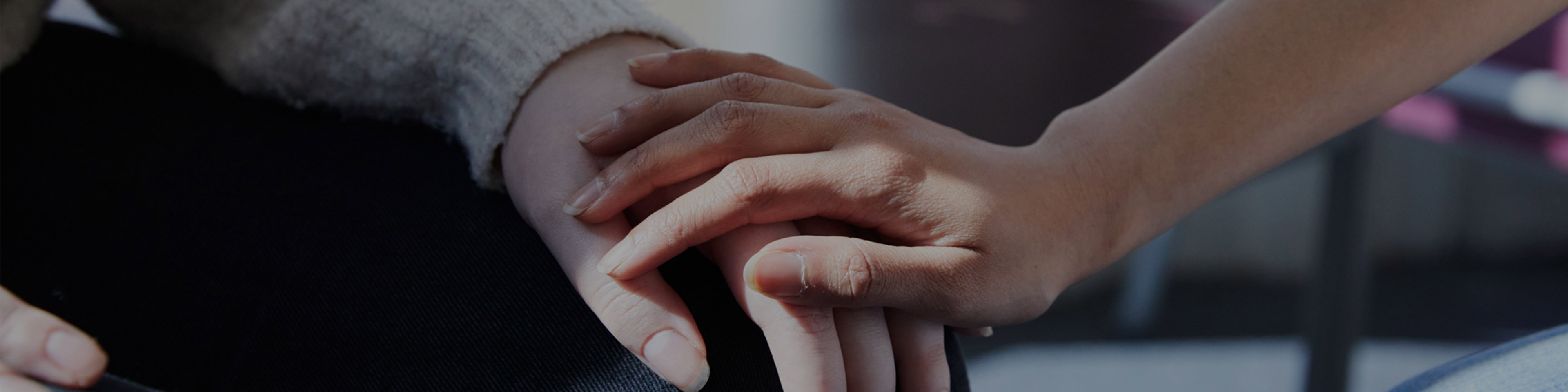 Clients holding hands in clinic