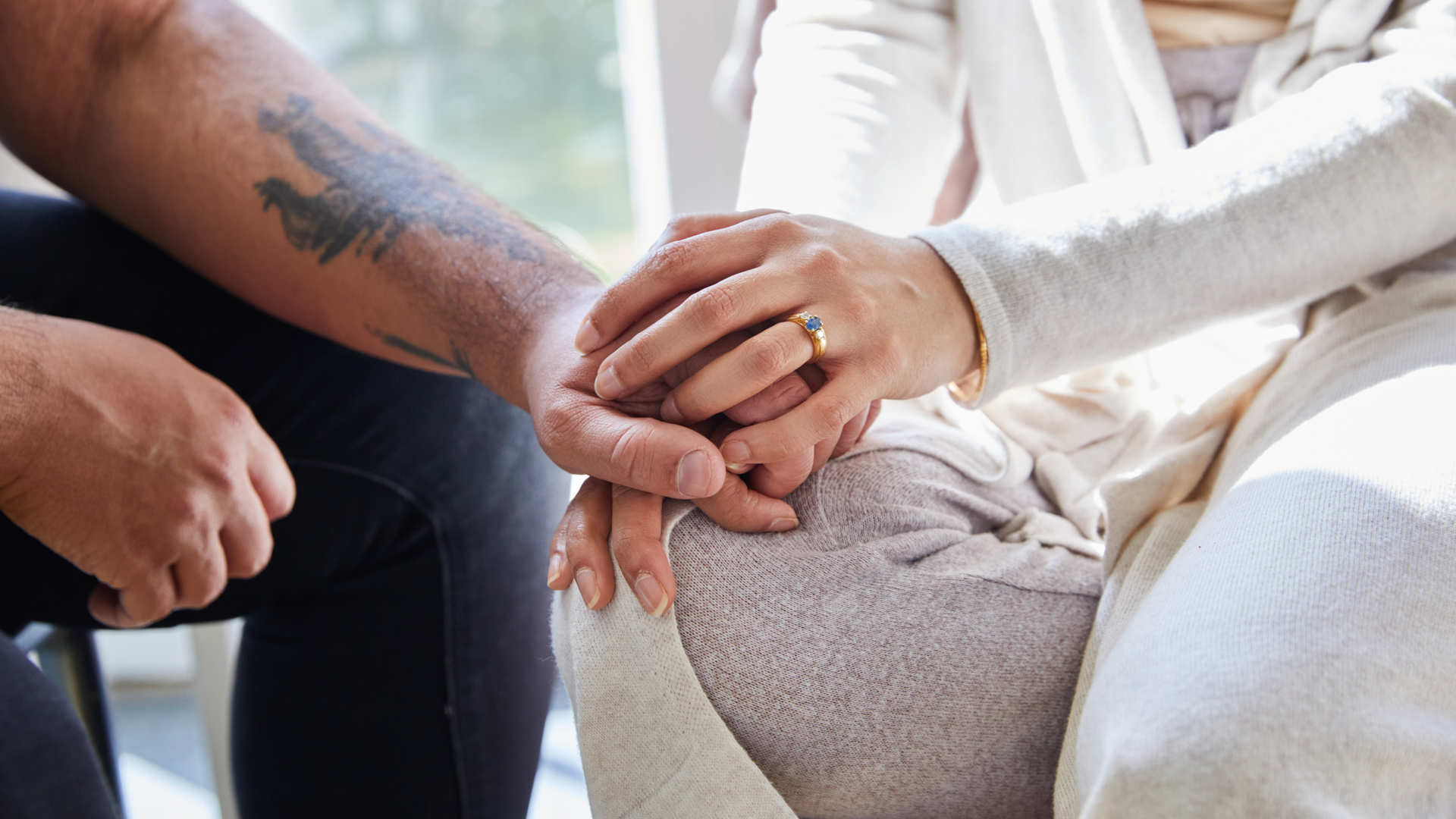 Clients holding hands in clinic