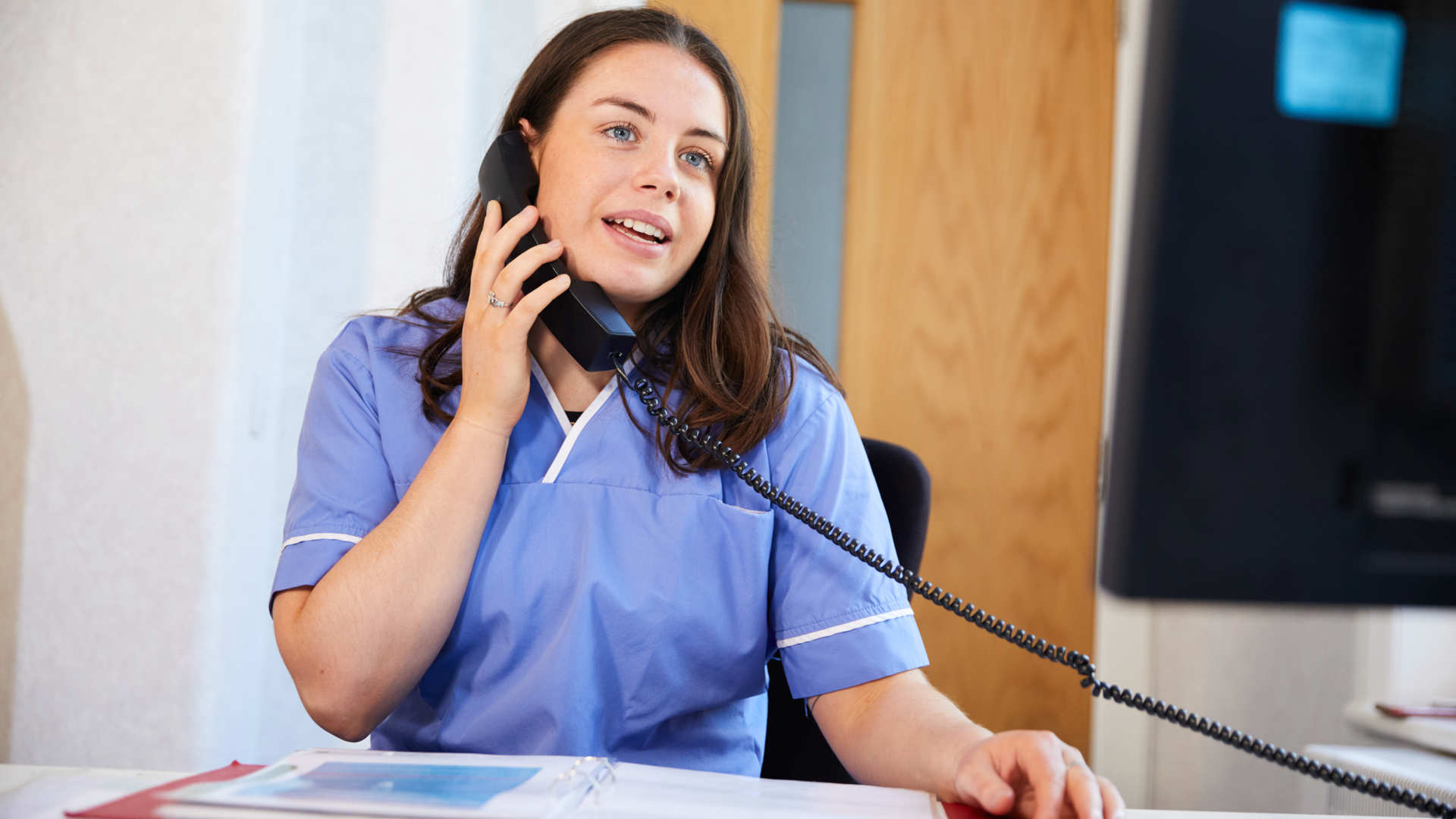 Nurse talking to client