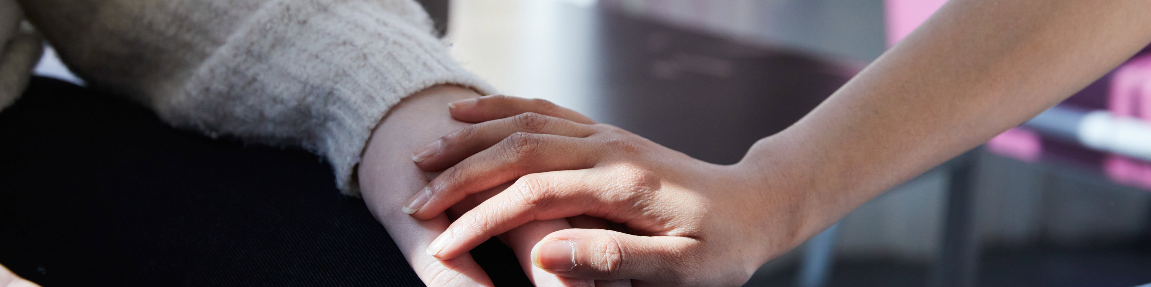 Clients holding hands in clinic